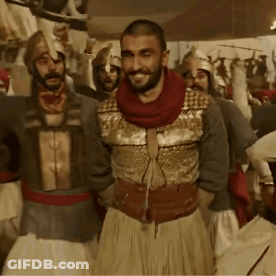 A Group Of Men In Armor Are Standing Together GIF