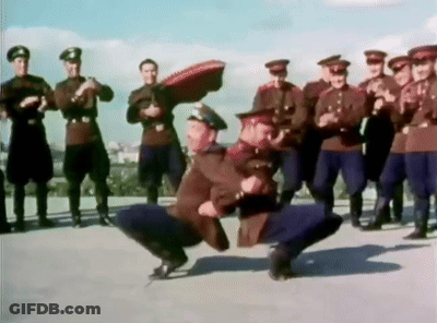 Men In Military Uniforms Dancing On Rooftop GIF