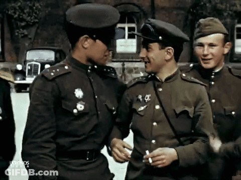 A Group Of Men In Military Uniforms Are Standing In Front Of A Building With The Word Ultimos On The Bottom GIF