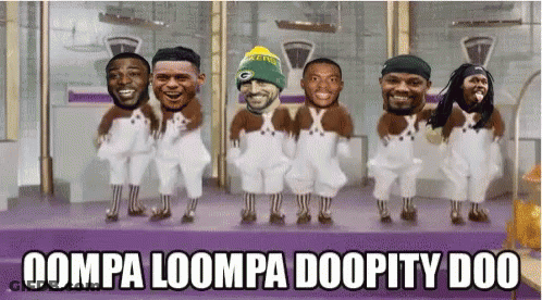 A Group Of Men In Overalls Are Dancing With The Words Oompa Loompa Doopity Doo GIF