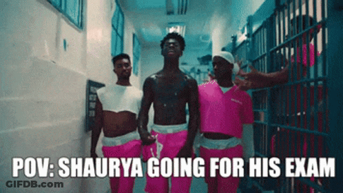 A Group Of Men In Pink Shorts Are Walking Down A Hallway With The Caption Pov : Shaurya Going For His Exam GIF