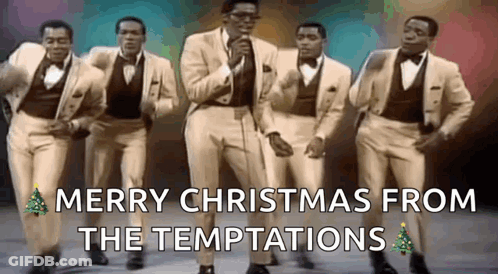 A Group Of Men In Suits And Bow Ties Are Singing And Dancing . GIF