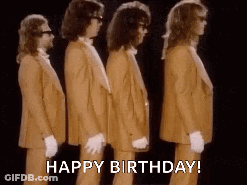 A Group Of Men In Suits And Gloves Are Standing Next To Each Other In A Line . GIF