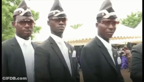 A Group Of Men In Suits And Hats Are Standing In A Line . GIF