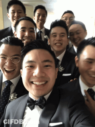 A Group Of Men In Suits And Ties Are Posing For A Photo GIF