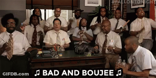 A Group Of Men In Suits And Ties Are Sitting Around A Table And Playing Instruments . GIF