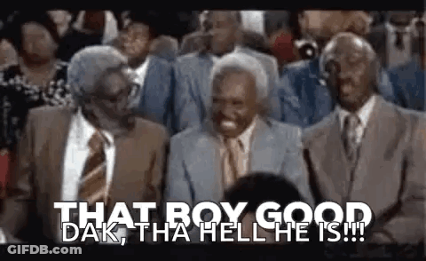 A Group Of Men In Suits And Ties Are Sitting In A Crowd . GIF