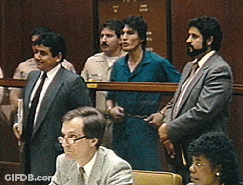 A Group Of Men In Suits And Ties Are Standing In A Room With The Number 11 On The Door GIF