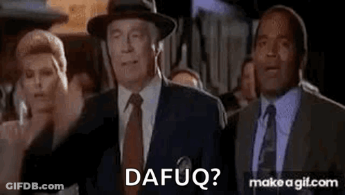 A Group Of Men In Suits And Ties Are Standing Next To Each Other And One Of Them Is Wearing A Hat . GIF