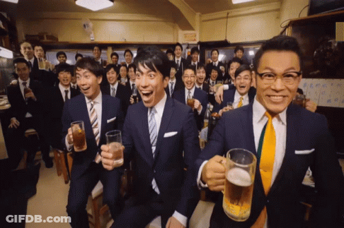 A Group Of Men In Suits And Ties Toasting With Beer Mugs GIF