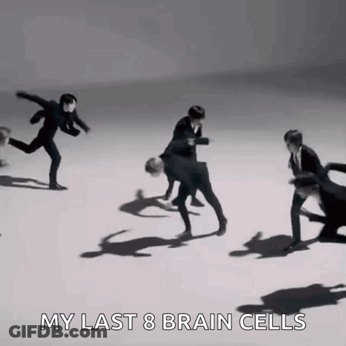 A Group Of Men In Suits Are Dancing On A White Surface With The Words `` My Last 8 Brain Cells '' . GIF