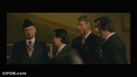 Laughing Men In Suits With Medal GIF