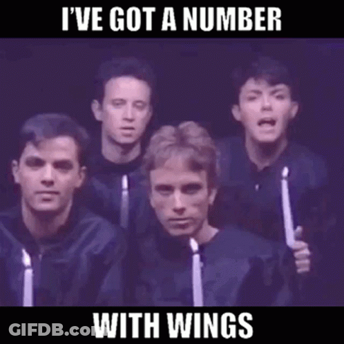 A Group Of Men Singing In A Choir With Candles In Their Hands GIF