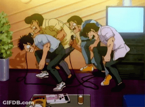 A Group Of Men Singing Into Microphones In A Room GIF