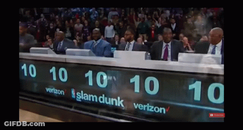 A Group Of Men Sit Behind A Scoreboard That Says Slam Dunk On It GIF