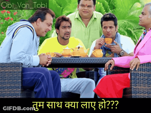 A Group Of Men Sitting Around A Table With A Caption In A Foreign Language That Says " Obil Van Tobi " GIF