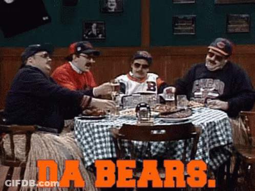 A Group Of Men Sitting Around A Table With The Words Da Bears Written On The Bottom GIF