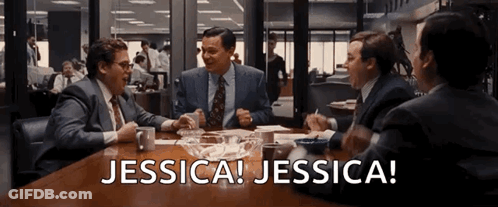 A Group Of Men Sitting Around A Table With The Words Jessica Jessica Written On The Screen GIF