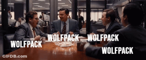 A Group Of Men Sitting Around A Table With Wolfpack Written On The Top GIF