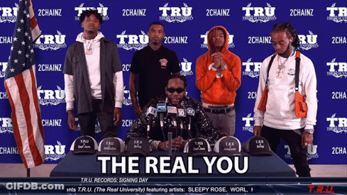 A Group Of Men Standing Around A Table With The Words The Real You On The Bottom GIF