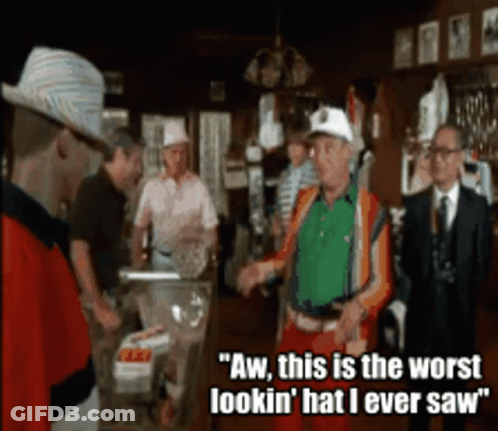 A Group Of Men Standing In A Room With One Saying Aw This Is The Worst Lookin ' Hat I Ever Saw ' GIF