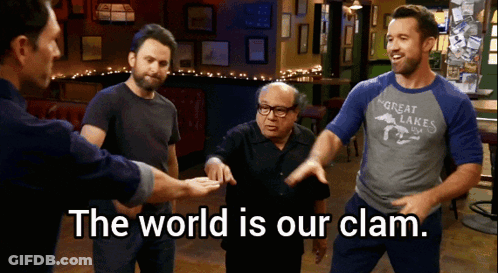 A Group Of Men Standing In A Room With The Words " The World Is Our Clam " GIF