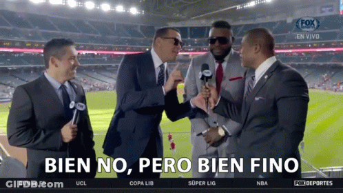 A Group Of Men Standing In Front Of A Screen That Says Bien No Pero Bien Fino On It GIF