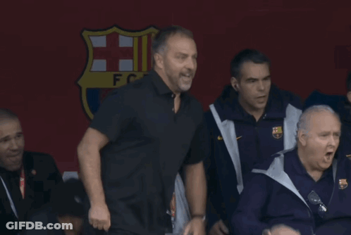 A Group Of Men Standing In Front Of A Sign That Says ' Fcb ' On It GIF