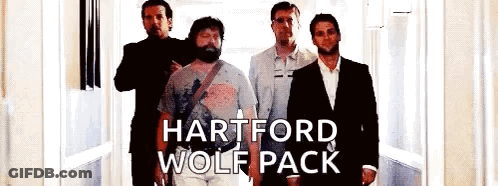 A Group Of Men Standing Next To Each Other In A Hallway With The Words Hartford Wolf Pack On The Bottom . GIF