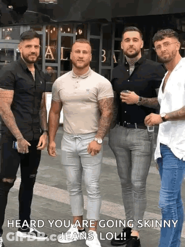 A Group Of Men Standing Next To Each Other On A Sidewalk With The Caption Heard You Are Going Skinny Jeans Lol . GIF