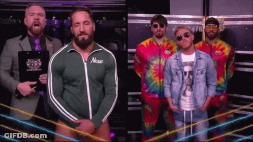 A Group Of Men Standing Next To Each Other With One Wearing A Green Jacket With The Word Nose On It GIF