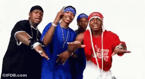 A Group Of Men Standing Next To Each Other With One Wearing A Red Shirt That Says ' Ford ' On It GIF