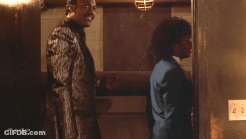 A Group Of Men Standing Next To Each Other With #Purplerain Written On The Bottom Right GIF