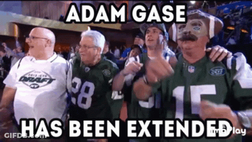 A Group Of Men Standing Next To Each Other With The Caption Adam Gase Has Been Extended . GIF