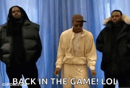 A Group Of Men Standing Next To Each Other With The Words `` Back In The Game ! Lol '' . GIF