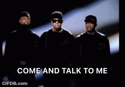 A Group Of Men Standing Next To Each Other With The Words Come And Talk To Me Above Them GIF