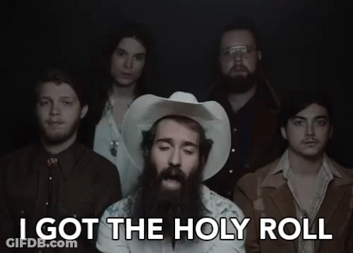 A Group Of Men Standing Next To Each Other With The Words I Got The Holy Roll GIF
