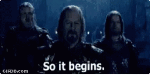 A Group Of Men Standing Next To Each Other With The Words `` So It Begins '' Written On The Screen . GIF