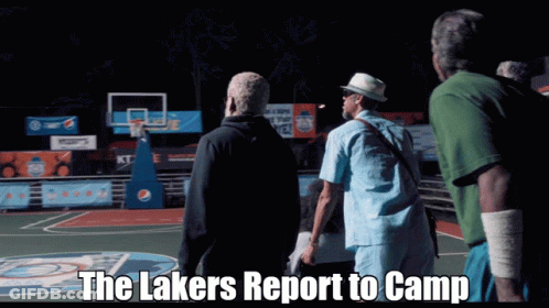 A Group Of Men Standing On A Basketball Court With The Words " The Lakers Report To Camp " Above Them GIF