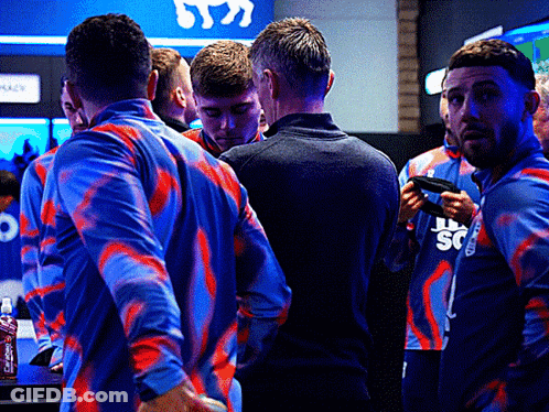 A Group Of Men Wearing Blue And Red Shirts With The Letter S On The Front GIF