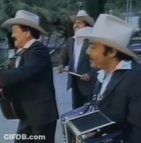A Group Of Men Wearing Cowboy Hats And Suits Are Playing Instruments GIF