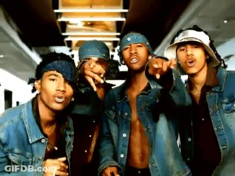 A Group Of Men Wearing Denim Jackets And Bandanas Pointing At The Camera GIF