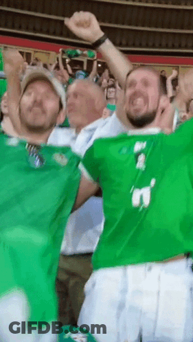 A Group Of Men Wearing Green Jerseys With The Number 3 On Them GIF