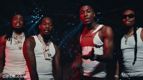 A Group Of Men Wearing White Tank Tops And Sunglasses GIF