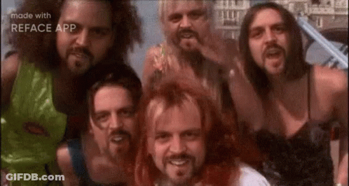 A Group Of Men With Beards Are Posing For A Picture . GIF