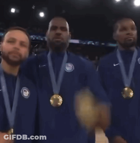 A Group Of Men With Medals Around Their Necks Are Standing Together GIF