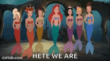 A Group Of Mermaids From The Little Mermaid Are Standing Next To Each Other In A Cave . GIF