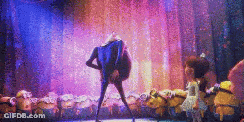 A Group Of Minions Are Dancing On A Stage With A Man In A Blue Suit . GIF
