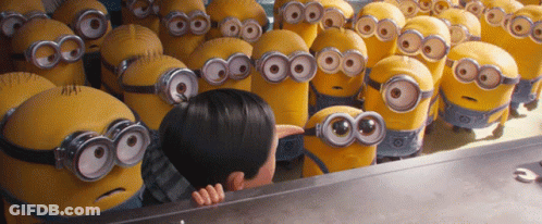 A Group Of Minions Are Gathered Around A Boy GIF