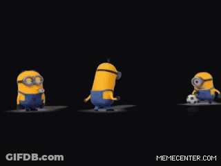 A Group Of Minions Are Standing Next To A Soccer Ball GIF